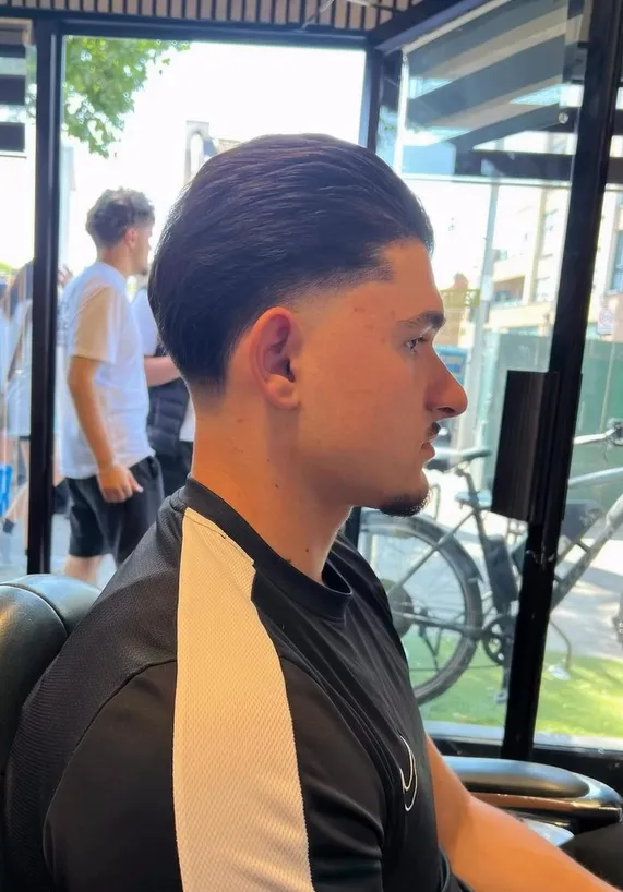 Taper fade finished by the shop window