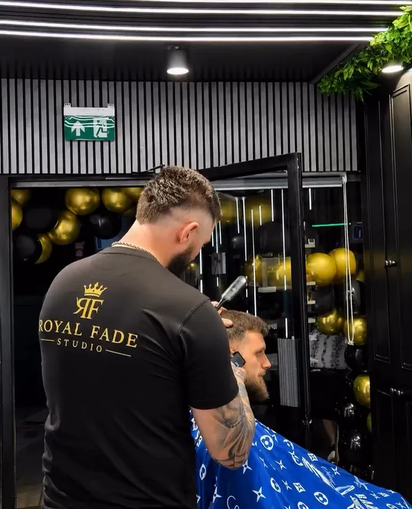 Open razor work at the chair by the shop window